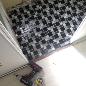 The flooring is finished in the bathroom.